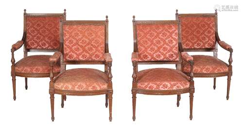 A set of four beech and upholstered armchairs in Louis XVI style