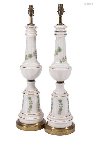 A pair of gilt brass mounted milk glass table lamps