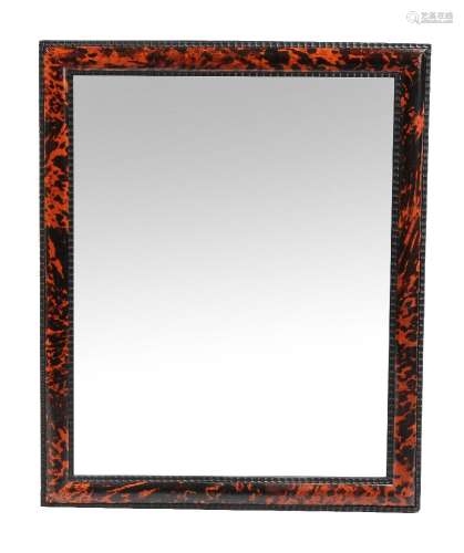 ϒ A tortoiseshell framed wall mirror