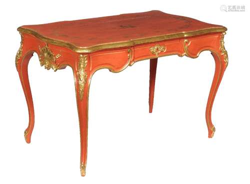 A red lacquer and parcel gilt bureau plat