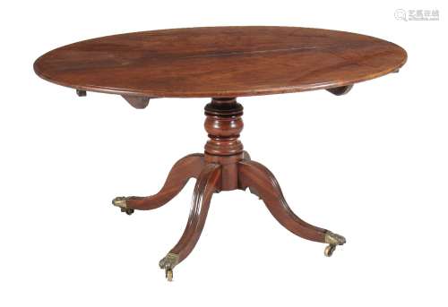 A George III mahogany oval dining or centre table