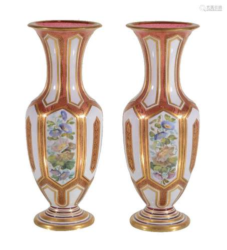 A pair of Bohemian ruby glass and opaque-white overlay baluster vases