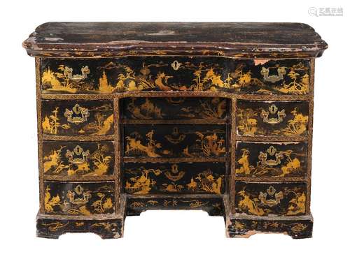 A black lacquered and parcel gilt papier mache kneehole desk