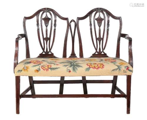 A mahogany double chair back settee in George III style