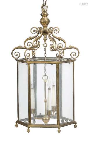 A gilt brass and glazed three light hexagonal hall lantern in George III taste