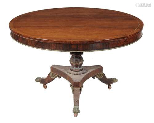 ϒ A Regency rosewood and brass strung centre table