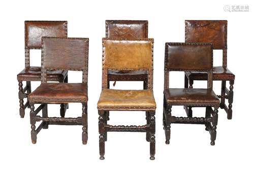 A harlequin set of oak and leather upholstered dining chairs