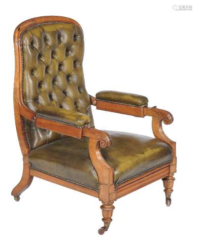 A Victorian green leather upholstered library armchair