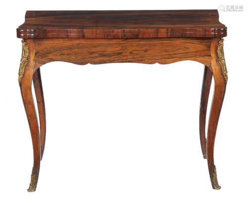 ϒ A rosewood card table in Louis XVI style