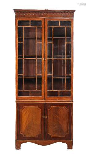 ϒ A George III mahogany and tulipwood banded cabinet