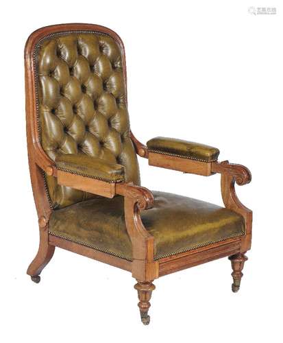 A Victorian green leather upholstered library armchair