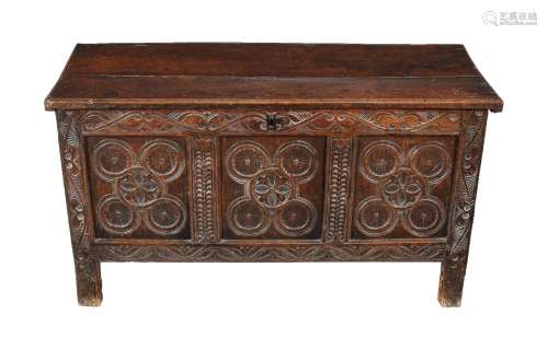 A carved oak triple panel coffer