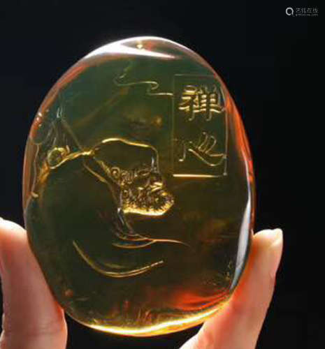 A MYANMAR AMBER CARVED PENDANT