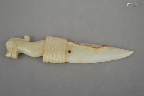 A JADE CARVED DAGGER SHAPED PENDANT