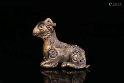 A GILT BRONZE BEAST SHAPED PAPERWEIGHT