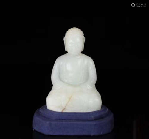 A HETIAN JADE CARVED BUDDHA STATUE