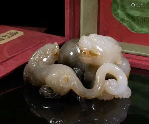 A HETIAN JADE CARVED BEAST FIGURE