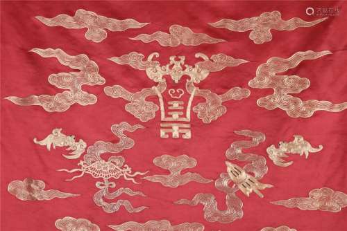 A SET OF FOUR PANELS OF CHINESE EMBROIDERY RED GROUND GOLD SILK DRAGON AND PHOENIX TAPESTRY