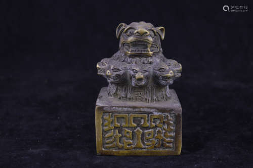 A BRONZE MOLDED BEAST SHAPED SEAL