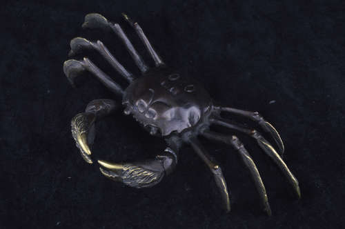 A CRAB SHAPED BRONZE FIGURE