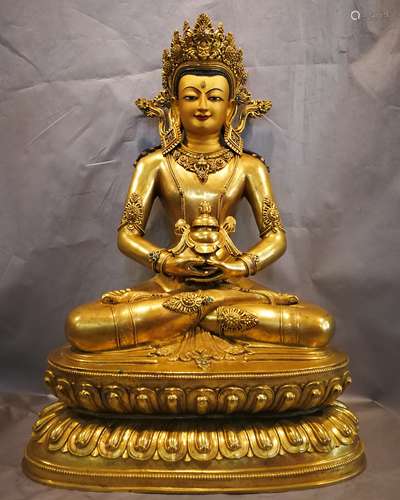 A BRONZE GLITED SHOU BUDDHA