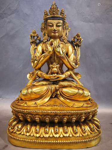 A BRONZE GLITED FOUR ARMS OF SHOU BUDDHA