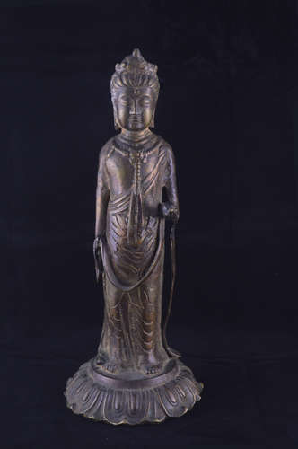 A BRONZE MOLDED GUANYIN STATUE