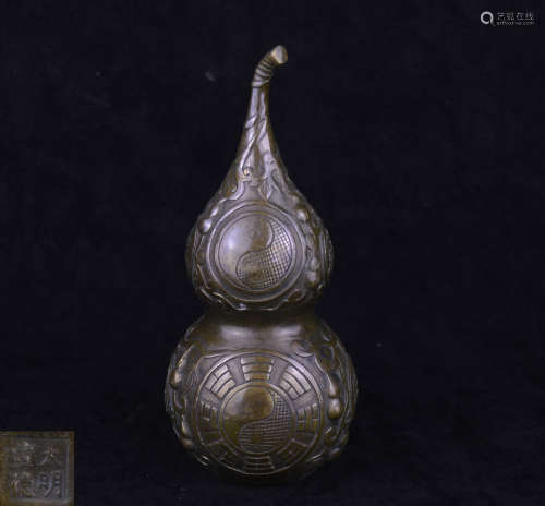 A BRONZE MOLDED GOURD-SHAPED VASE