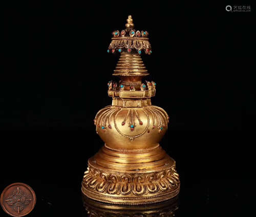 A GILT BRONZE MOLDED BUDDHIST TOWER