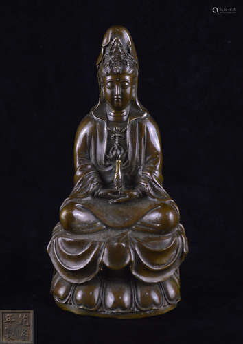 A BRONZE MOLDED GUANYIN STATUE