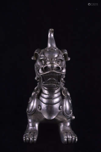 A WHITE COPPER BEAST SHAPED FIGURE