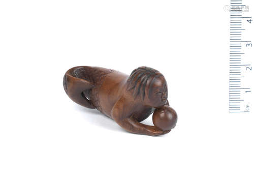 Late 18th/early 19th century A wood netsuke of a mermaid