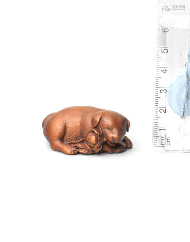 By Shugetsu, Edo, early 19th century A wood netsuke of a dog