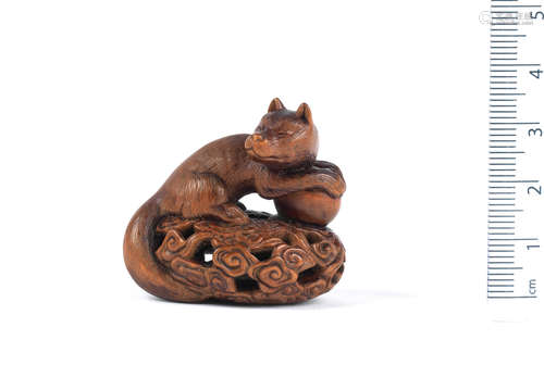 By Shoju(sai), 19th century A wood netsuke of the Inari fox