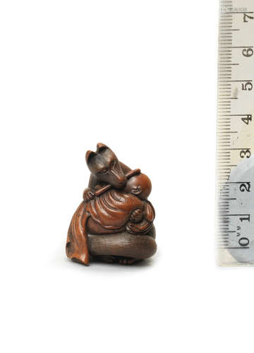 By Chikusai, Edo, late 19th century A wood netsuke of Kuzunoha