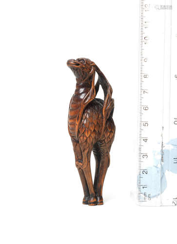 19th century A wood netsuke of a kirin