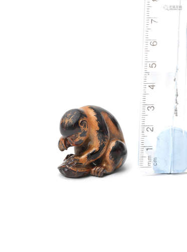 By Okatori, Kyoto, early 19th century A lacquered-wood netsuke of a monkey and tortoise