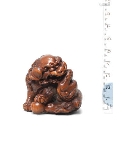 18th century A wood netsuke of a shishi