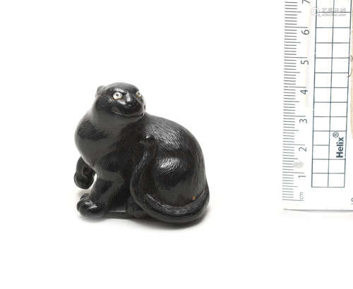 By Tategawa Takusai, Suwa, Shinano Province, late 19th century An ebony netsuke of a panther