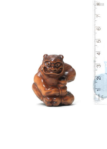 By Miwa, Edo, late 18th century A wood netsuke of an oni