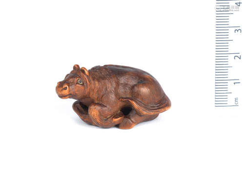 By Kokei, Kuwana, Ise Province, 19th century A wood netsuke of a horse