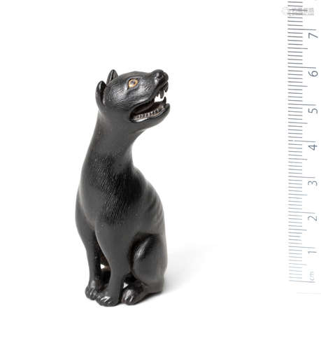 By Rensha, Edo, 19th century A kurogaki wood netsuke of a wolf or wild dog (yama-inu)