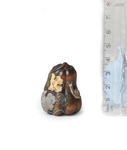 Attributed to Shibayama Soichi, late 19th century An inlaid wood netsuke of a gourd