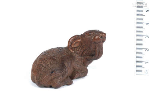 By Kigetsu, late 18th/early 19th century A large wood netsuke of a goat