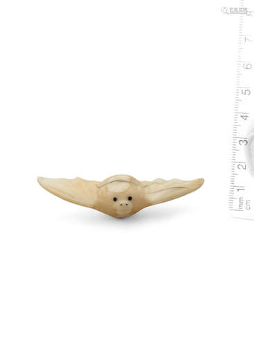 Late 18th/19th century A marine tooth netsuke of a flying bat