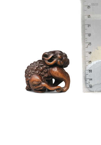 Early 19th century A wood netsuke of a baku