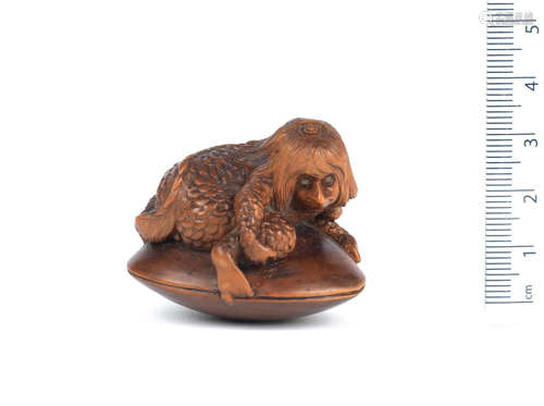 By Hideharu, Nagoya, 19th century A wood netsuke of a kappa