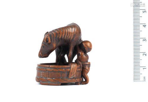 By Tadahisa, Nagoya, 19th century A wood netsuke of a horse and groom　