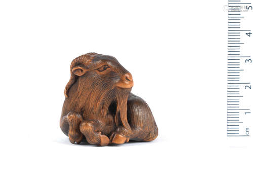 By Masanao, Yamada, Ise Province, 19th century A wood netsuke of a goat