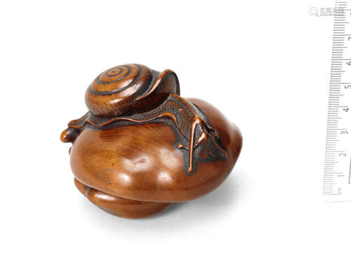 Late 18th/early 19th century A large wood netsuke of a snail on a mushroom